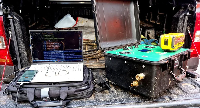 Laptop and SmartSite testing equipment in a work vehicle